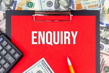 ENQUIRY - word on the background of money (dollars), a notepad and a pen with a calculator. Business concept (copy space).