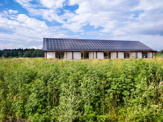 Fototapeta na wymiar Farmhouse with solar panels for renewable energy