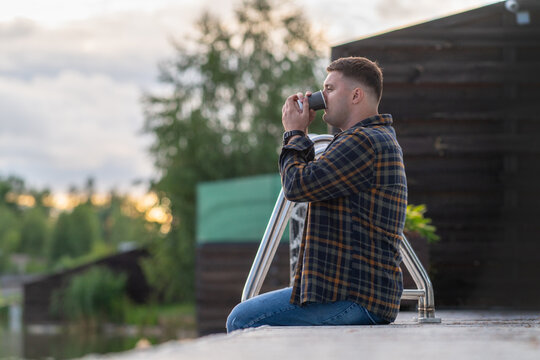 Young man gulping down cup of refreshing takeaway coffee