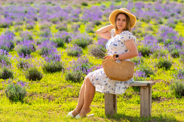 Young woman modelling summer fashion in a lavender field
