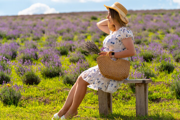 Young fashion model posing in a field of lavender