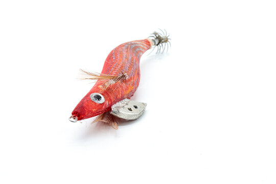 artificial red eging lure for squid fishing isolated on white background
