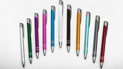 Closeup shot of colorful pens isolated on white background