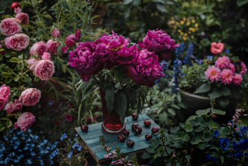 Peonies in a vase in the garden