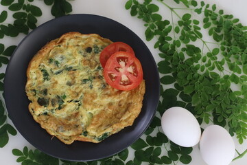 Moringa leaves omelet. Omelette with Moringa Leaves added to it is a wholesome omelette recipe,...