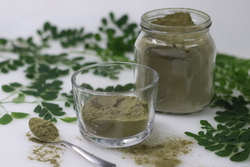 Dried moringa leaf powder. Powdered form of sun dried stemless drumstick leaves. Helps to add moringa leaves to food.