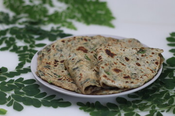 Moringa paratha or drumstick leaves paratha. Indian flatbread with dough made of whole wheat flour...