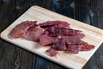 thin pieces of dried meat with spices