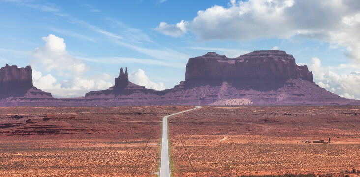 Scenic Road in the Dry Desert with Red Rocky Mountains in Background. Forrest Gump Point in Oljato-Monument Valley, Utah, United States. Cloudy Sky Art Render