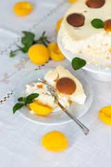 Homemade cheesecake cheesecake with apricots and fresh apricots and mint leaves