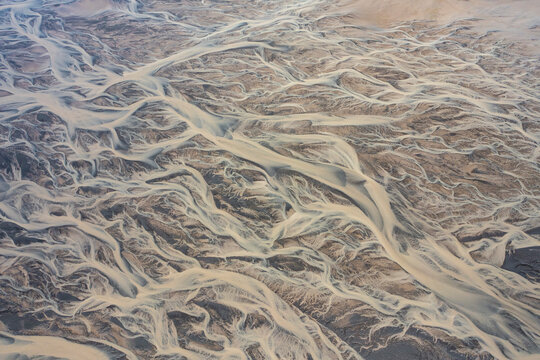 Aerial view of a water abstract pattern from a river estuary in Iceland.