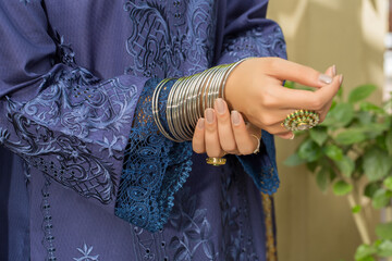 Women hands with bangles and rings