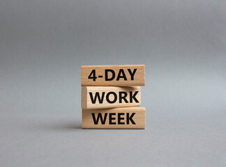 4-day work week symbol. Concept words 4-day work week on wooden blocks. Beautiful grey background. Business and 4-day work week concept. Copy space