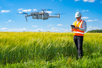 Geodetic survey area. Male surveyor launches drone. Geodetic survey with drone. Geodetic drone on...