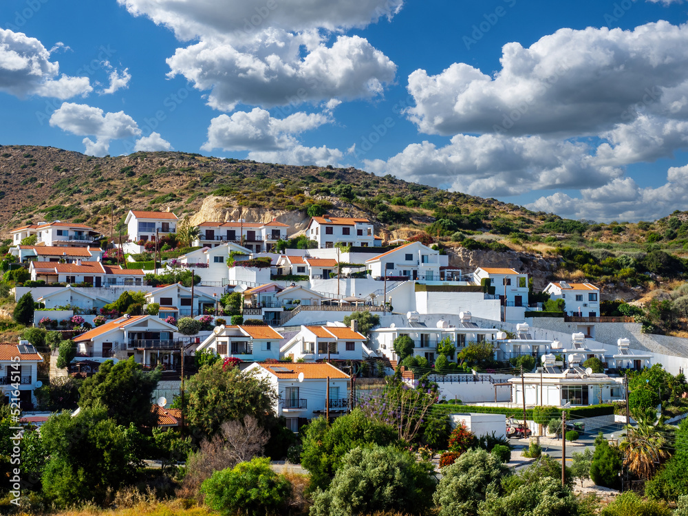 Wall mural Village of Pissouri in Cyprus. White cottages among rocks. Resort town at foot mountain. Rest in city Pissouri. Rent apartments on island Cyprus. Mini hotels in Cyprus. Tour to Mediterranean cities