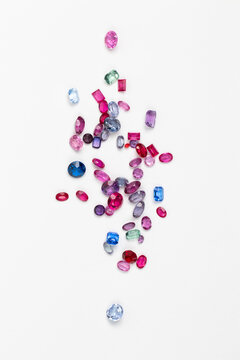 Synthetic Stones for jewellery making. Faceted colorful glass rhinestones on White