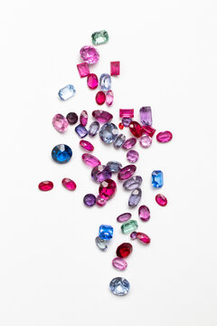 Synthetic Stones for jewellery making. Faceted colorful glass rhinestones on White
