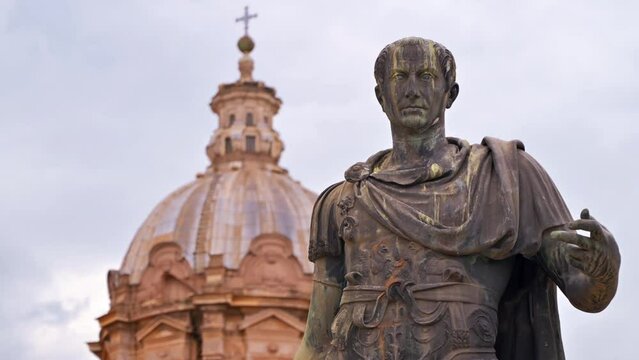 Statue of Julius Caesar located in the centre of Rome, Italy. Buildings on the background