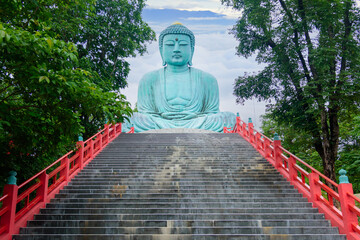 The Great Buddha (Daibutsu) on the grounds of Wat Phra That Doi Phra Chan Temple in lampang Thailand - obrazy, fototapety, plakaty