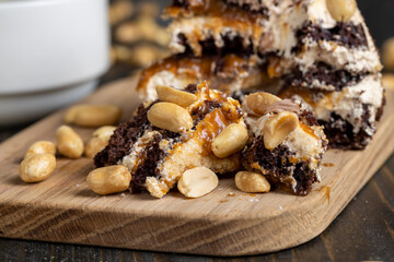 caramel cake with peanuts and buttercream, close up