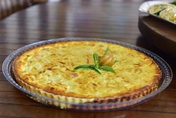 shrimp and cheese quiche on wooden table
