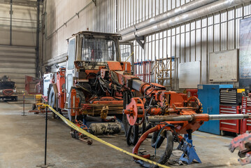 Disassembled underground drilling machine in the repair shop.