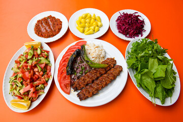 Beef steak grill with rice pilaf, fried potatoes, grilled pepper and tomatoes.Mix Platter with Beef rips, Cutlets, Potatoes and Sauces.