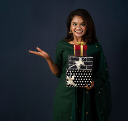 Portrait of young happy smiling woman or Girl holding gift box.