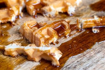 square sweet soft waffles in bee honey