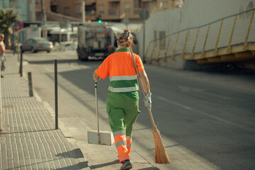 City Service Worker Cleans City Streets