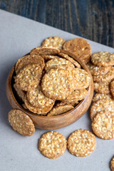 oatmeal thin round cookies with lots of sesame seeds