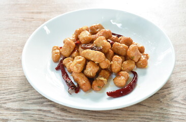 fried chicken meat with dry chili on plate