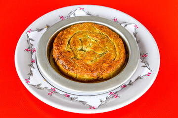 Homemade burek (borek)  with cheese and spinach and boiled egg.Traditional food. Peynirli, Patatesli, kiymali kol boregi.