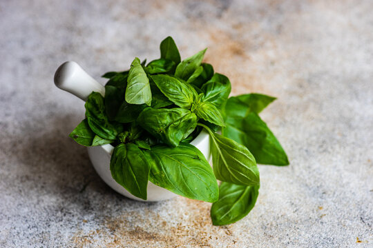 Close-Up of fresh basil in a mortar and pestle