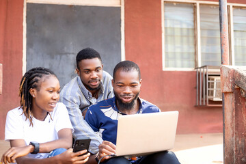 group of young African American millennial student using laptop surfing online