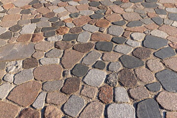A road paved with made of stones and cobblestones for vacationing people