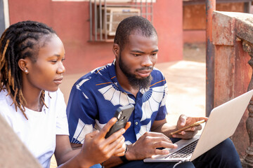 two young freelancers using laptop written blog article for readers online