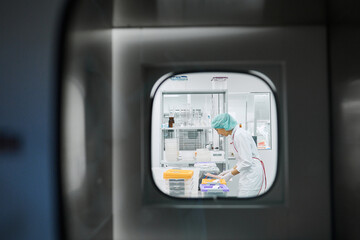 Women work in the lab. Conducts experiments on vaccines.