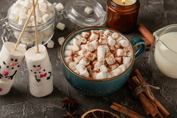 Hot chocolate mug with melted marshmallow snowman.Sweet treat for kids funny marshmallow snowman. Christmas winter holiday decoration. New Year card.Winter hot drink.