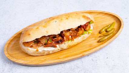 Chicken doner kebab on wooden tray top view isolated