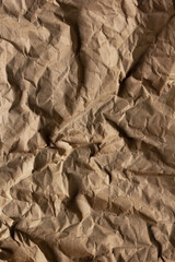 Crumpled parcel paper background texture. Recycling concept and brown paper