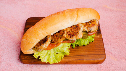 Chicken kofta doner kebab on wooden tray top view isolated