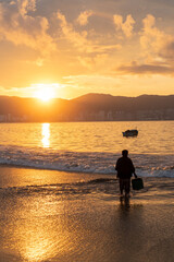Fisherman at dawn, Acapulco Bay, Mexico