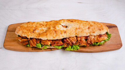Chicken doner kebab on wooden tray top view isolated