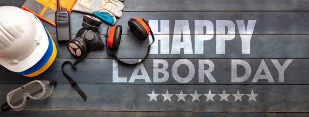 Happy Labor Day text and construction tools on wood. USA holiday celebration