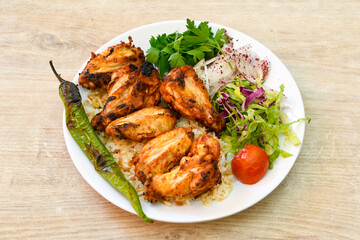 Chicken wings barbeque in a dish with BBQ grill sauce . Izgara tavuk kelebek sis kanat. Tavuk sis, gogus.