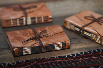 Vintage Dark Brown Leather Notebook Journal on Wooden Table