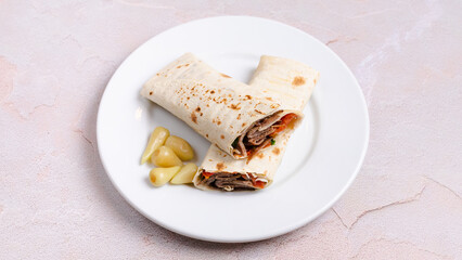 Beef durum kebab in plate. Beef lavash doner kebab