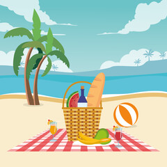 Hamper with juice bottles and fruits with bread on sunny beach