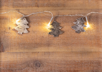 Christmas tree shape light in christmas on wooden background